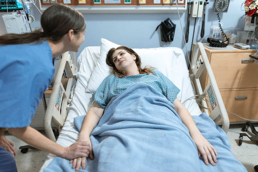 Nurse caring for a patient during post-surgical recovery in a hospital room