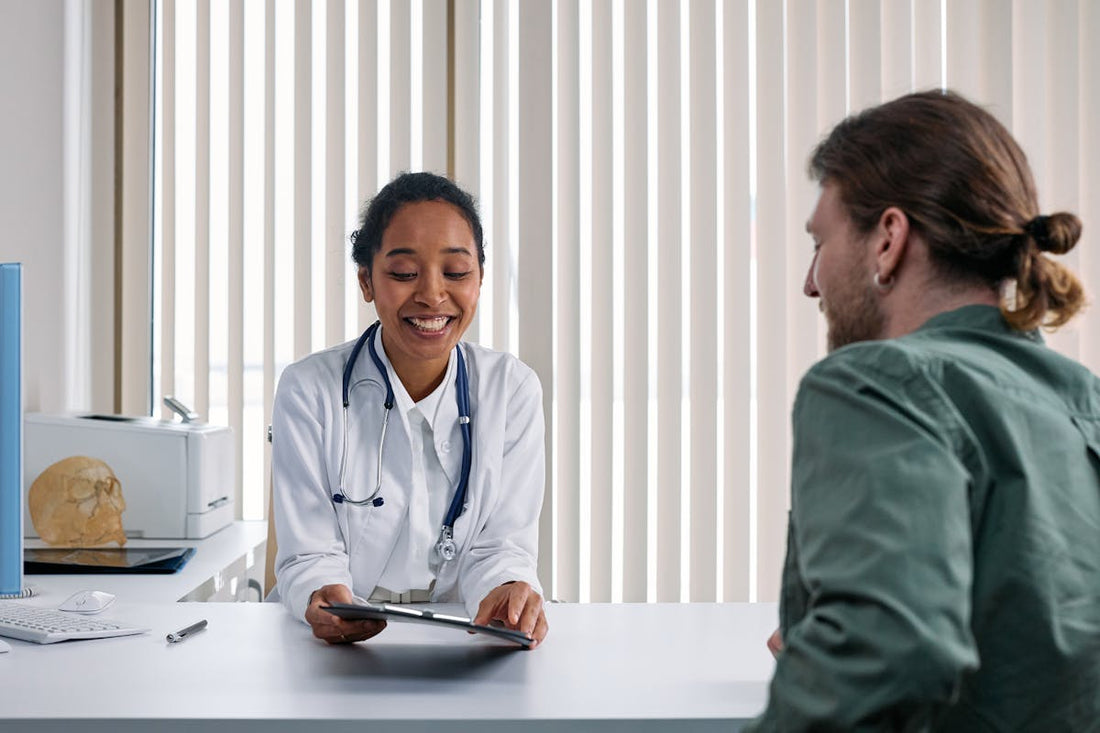 Doctor consulting with a patient about treatment side effects and contraindications